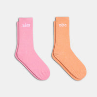 Pack de chaussettes colorées avec une paire rose et une paire orange, pour un style audacieux et tendance.